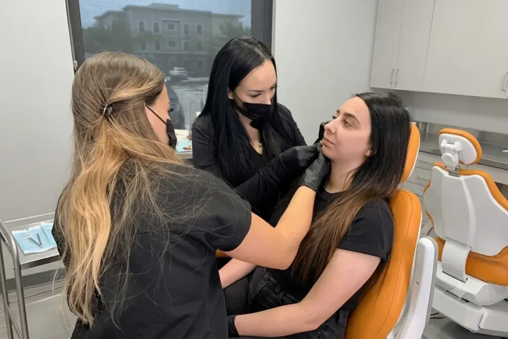 Provider performing a neuromodulator treatment to address facial asymmetry